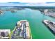 Expansive aerial view showcases waterfront condos, parking, and stunning water views at 7625 Sun Island S Dr # 304, South Pasadena, FL 33707