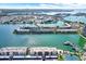 Aerial view of waterfront community with resort-style amenities, lush landscaping, and boat docks at 7625 Sun Island S Dr # 304, South Pasadena, FL 33707