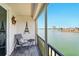 Cozy balcony with seating overlooking the waterfront, providing a serene outdoor space at 7625 Sun Island S Dr # 304, South Pasadena, FL 33707