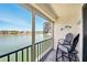 Relaxing balcony with chairs offers scenic views of the bay and surrounding condos at 7625 Sun Island S Dr # 304, South Pasadena, FL 33707