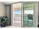 Balcony view overlooking a scenic waterfront, accessible through sliding glass doors from the living room at 7625 Sun Island S Dr # 304, South Pasadena, FL 33707