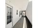 Well-maintained hallway with bright lighting and neutral tones leading to individual unit entrances at 7625 Sun Island S Dr # 304, South Pasadena, FL 33707