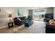 Comfortable living room with balcony access offering water views and plenty of natural light at 7625 Sun Island S Dr # 304, South Pasadena, FL 33707