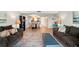 Inviting living area with plush sofas, stylish rug, and open access to the dining area at 7625 Sun Island S Dr # 304, South Pasadena, FL 33707