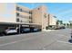 Exterior shot of designated parking area with covered spaces, adjacent to condo building at 7625 Sun Island S Dr # 304, South Pasadena, FL 33707