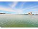Expansive water view, showcasing the serene setting and distant condo buildings across the water at 7625 Sun Island S Dr # 304, South Pasadena, FL 33707