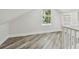 Bright attic with wood-look floors, window, and ample space at 816 9Th Sw Ave, Largo, FL 33770