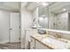 Modern bathroom featuring a granite countertop, storage vanity, and updated fixtures at 816 9Th Sw Ave, Largo, FL 33770