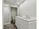 Bathroom featuring a double vanity, separate toilet room, and a glass door shower at 816 9Th Sw Ave, Largo, FL 33770