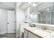 Bathroom with granite countertop vanity and modern mirror cabinet at 816 9Th Sw Ave, Largo, FL 33770