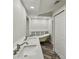 Modern bathroom featuring a clawfoot tub, double vanity, and stylish wood-look flooring at 816 9Th Sw Ave, Largo, FL 33770