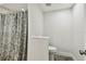 Clean bathroom with a shower featuring a patterned curtain and modern fixtures at 816 9Th Sw Ave, Largo, FL 33770