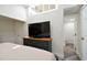 Comfortable bedroom featuring a large dresser, television, and access to the bathroom at 816 9Th Sw Ave, Largo, FL 33770