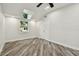 Bright bedroom with wood-look floors, a modern ceiling fan, a skylight, and double door closet at 816 9Th Sw Ave, Largo, FL 33770