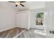 Bright bedroom with light-colored walls, vinyl flooring, closet, and natural light at 816 9Th Sw Ave, Largo, FL 33770