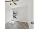 Cozy bedroom with light-colored walls, vinyl flooring, window, and natural light at 816 9Th Sw Ave, Largo, FL 33770