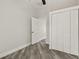 Comfortable bedroom with light-colored walls, vinyl flooring, closet, and doorway at 816 9Th Sw Ave, Largo, FL 33770