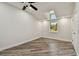 Bright bedroom features a skylight, a window, and gray wood-look flooring at 816 9Th Sw Ave, Largo, FL 33770