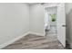 Bright bedroom with white walls and modern flooring leading into an ensuite bathroom at 816 9Th Sw Ave, Largo, FL 33770