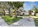 Charming home with unique exterior details and a spacious driveway at 816 9Th Sw Ave, Largo, FL 33770