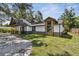 Well-maintained home with unique architectural details, lush landscaping, and manicured lawn at 816 9Th Sw Ave, Largo, FL 33770