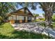Charming home with unique exterior details and a spacious driveway at 816 9Th Sw Ave, Largo, FL 33770