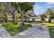 Charming home with unique exterior details and a spacious driveway at 816 9Th Sw Ave, Largo, FL 33770
