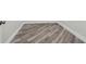 Close-up of new laminate flooring that enhances the room with its unique diagonal pattern design at 816 9Th Sw Ave, Largo, FL 33770
