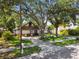 Charming home with mature trees, craftsman details, and well-manicured front lawn at 816 9Th Sw Ave, Largo, FL 33770