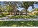 Beautiful home with a well-kept lawn, mature trees, and a welcoming front exterior at 816 9Th Sw Ave, Largo, FL 33770