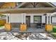 Inviting front porch with stylish columns and seating area at 816 9Th Sw Ave, Largo, FL 33770