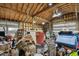 Cluttered garage with exposed rafters, tools, and storage at 816 9Th Sw Ave, Largo, FL 33770