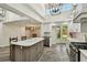 Bright kitchen with white cabinets, stainless steel appliances, and a large island at 816 9Th Sw Ave, Largo, FL 33770