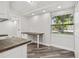 Charming kitchen featuring a built-in desk area and ample natural light at 816 9Th Sw Ave, Largo, FL 33770