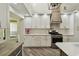 Beautiful kitchen with new white cabinets, stone countertops and stainless steel appliances at 816 9Th Sw Ave, Largo, FL 33770