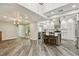 Open concept living space flows into an updated kitchen with stainless appliances and an island at 816 9Th Sw Ave, Largo, FL 33770