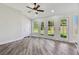 Bright living room featuring multiple windows and doors offering views of the backyard at 816 9Th Sw Ave, Largo, FL 33770