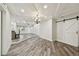 Open living area with modern lighting, sleek flooring, and access to backyard at 816 9Th Sw Ave, Largo, FL 33770