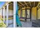 Covered patio with ceiling fan, outdoor furniture, canoe, and view of the backyard at 816 9Th Sw Ave, Largo, FL 33770