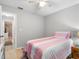 Bright bedroom boasts wood floors and ample space, perfect for relaxation and rest at 8208 Volusia Pl, Tampa, FL 33637