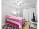 Bright bedroom includes wood floors and plenty of closet space, creating a clean, open space at 8208 Volusia Pl, Tampa, FL 33637
