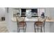 A cozy breakfast bar area with seating, connecting the kitchen and living spaces at 8208 Volusia Pl, Tampa, FL 33637