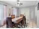 Cozy dining area with a modern table, seating four, and natural lighting at 8208 Volusia Pl, Tampa, FL 33637