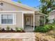 Inviting front entrance to a home with beautiful landscaping and well-maintained exterior at 8208 Volusia Pl, Tampa, FL 33637