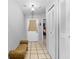 Inviting hallway features neutral tile flooring and access to bedrooms and living spaces at 8208 Volusia Pl, Tampa, FL 33637