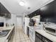 Well-lit kitchen featuring ample counter space and storage solutions with convenient appliances at 8208 Volusia Pl, Tampa, FL 33637