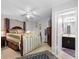 Spacious main bedroom with en-suite bathroom, ceiling fan, and walk-in closet at 8208 Volusia Pl, Tampa, FL 33637
