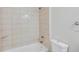 Bathroom features a shower, toilet and towel ring at 8521 N 29Th St, Tampa, FL 33604