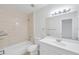 Bathroom features a shower, toilet, vanity and mirror at 8521 N 29Th St, Tampa, FL 33604