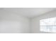 Bright bedroom features a window with natural light and neutral walls at 8521 N 29Th St, Tampa, FL 33604